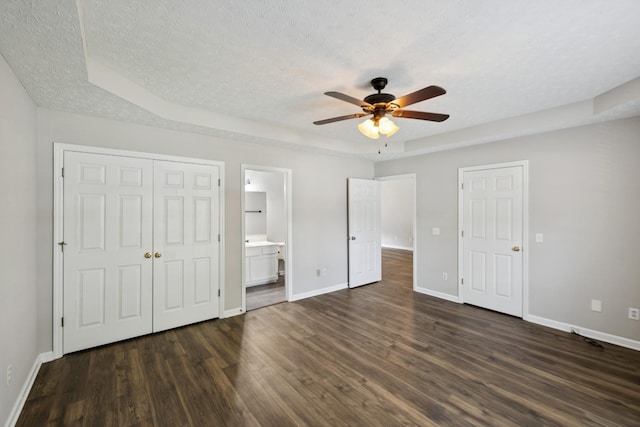 7616 Hudlow Ct, Fairview, TN 37062 - unfurnished bedroom featuring a textured ceiling, dark wood finished floors, ensuite bathroom, and a ceiling fan