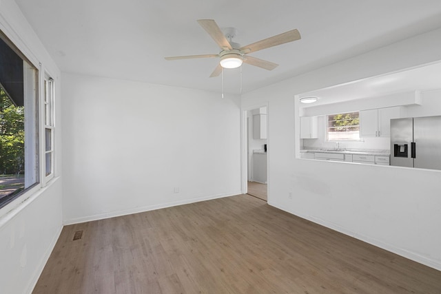 1401 Bearwallow Rd, Ashland City, TN 37015 - empty room with wood finished floors and a ceiling fan