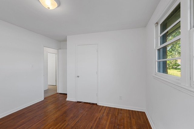 1401 Bearwallow Rd, Ashland City, TN 37015 - unfurnished bedroom featuring dark wood-style floors and baseboards