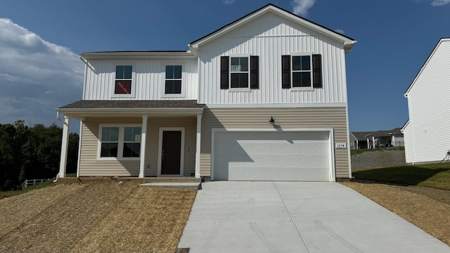 3294 Barrel Oak Pass, Columbia, TN 38401 - view of front facade featuring an attached garage, concrete driveway, board and batten siding, and covered porch