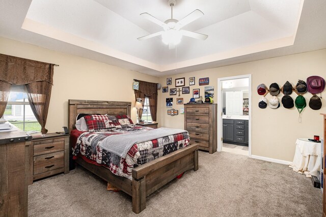 8100 Cedar Forrest Rd, Lascassas, TN 37085 - bedroom featuring a raised ceiling, light colored carpet, ensuite bath, and a ceiling fan