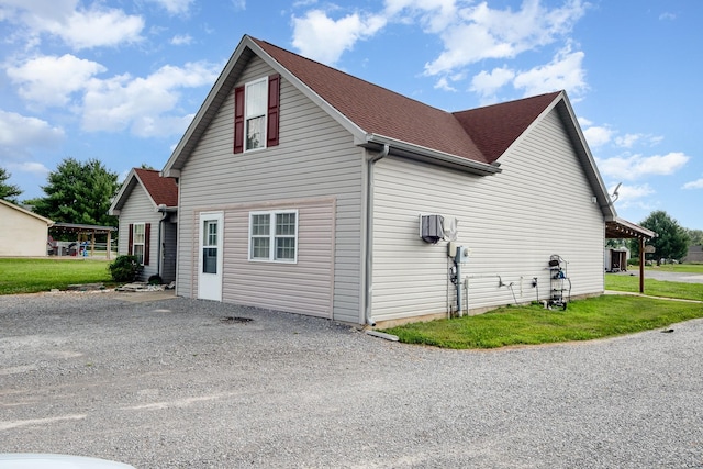 8100 Cedar Forrest Rd, Lascassas, TN 37085 - view of property exterior featuring driveway, roof with shingles, and a yard