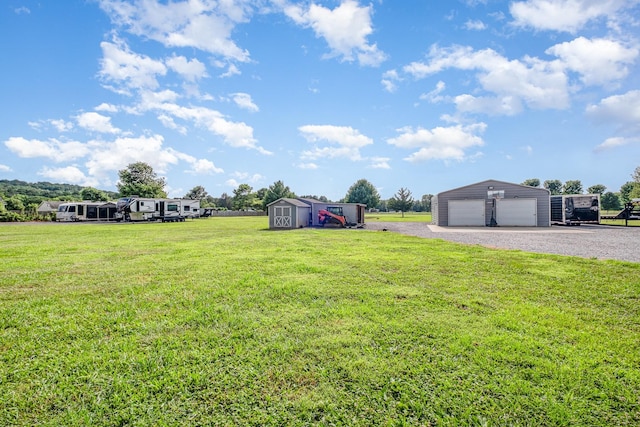 8100 Cedar Forrest Rd, Lascassas, TN 37085 - view of green lawn featuring a detached garage and a shed