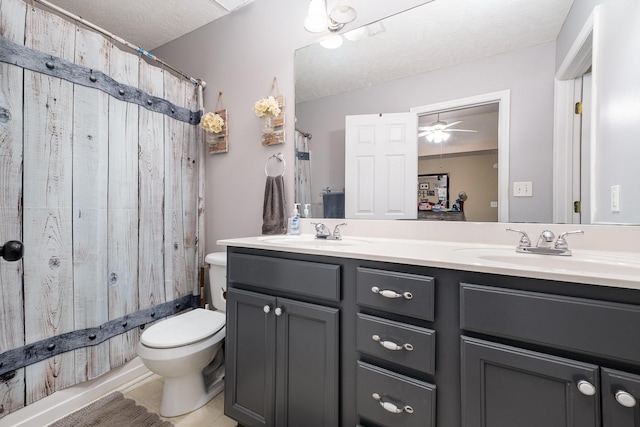 8100 Cedar Forrest Rd, Lascassas, TN 37085 - bathroom with double vanity, a textured ceiling, tile patterned flooring, and a ceiling fan