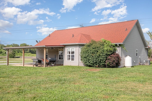 8100 Cedar Forrest Rd, Lascassas, TN 37085 - rear view of house with a patio, an attached carport, and a yard