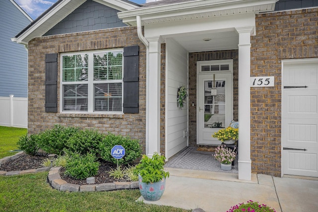 155 Nunally Dr, Baxter, TN 38544 - property entrance featuring a garage and brick siding