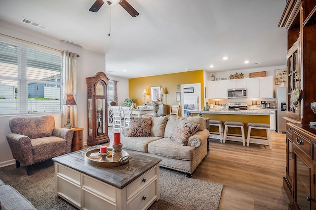 155 Nunally Dr, Baxter, TN 38544 - living room with wood finished floors, ceiling fan, and recessed lighting