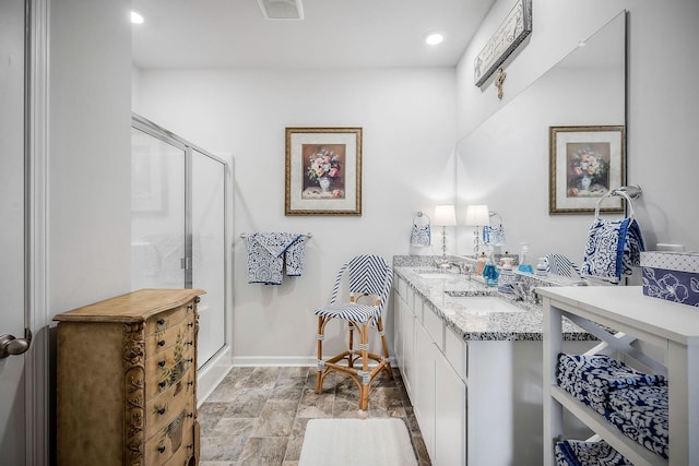 155 Nunally Dr, Baxter, TN 38544 - bathroom with a stall shower, double vanity, recessed lighting, and stone finish floors