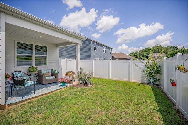 155 Nunally Dr, Baxter, TN 38544 - fenced backyard featuring a patio area and an outdoor hangout area