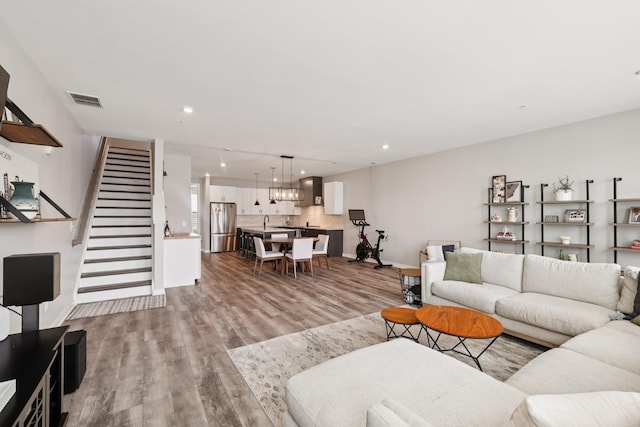 2006 Edison Park Ln, Nashville, TN 37209 - living area with wood finished floors, stairs, and recessed lighting