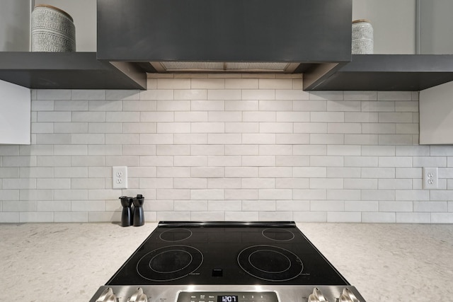 2006 Edison Park Ln, Nashville, TN 37209 - kitchen featuring decorative backsplash, light countertops, exhaust hood, wall chimney exhaust hood, and range