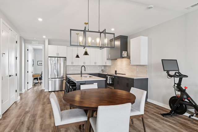 2006 Edison Park Ln, Nashville, TN 37209 - dining space featuring wood finished floors, recessed lighting, and a chandelier