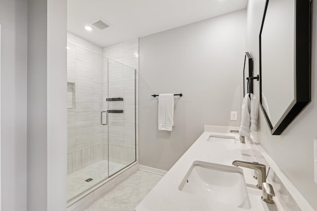 2006 Edison Park Ln, Nashville, TN 37209 - bathroom with a stall shower, double vanity, recessed lighting, and tile patterned floors