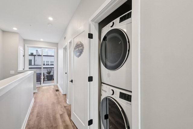 2006 Edison Park Ln, Nashville, TN 37209 - laundry area with stacked washing machine and dryer, light wood-style flooring, and recessed lighting