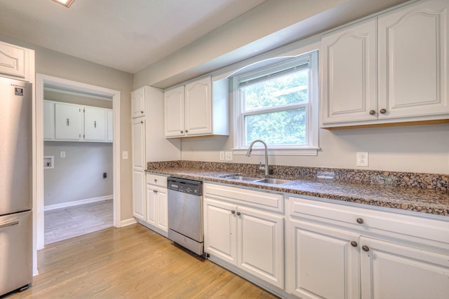 1213 N Graycroft Ave, Madison, TN 37115 - kitchen featuring stainless steel appliances, white cabinetry, light wood-type flooring, and dark stone countertops