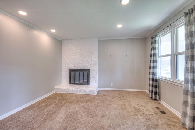 1213 N Graycroft Ave, Madison, TN 37115 - unfurnished living room featuring crown molding, light carpet, a stone fireplace, and recessed lighting