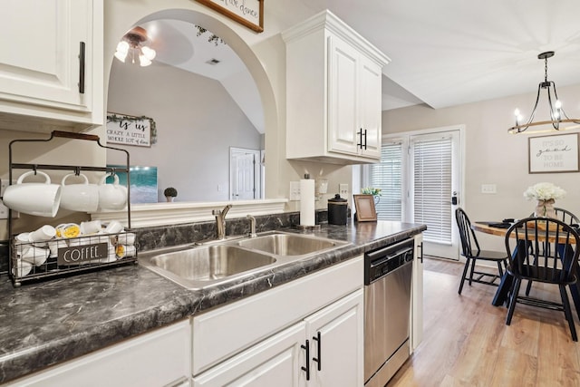 1319 Knoll Ln, Lebanon, TN 37087 - kitchen featuring stainless steel dishwasher, dark countertops, white cabinets, light wood finished floors, and a chandelier