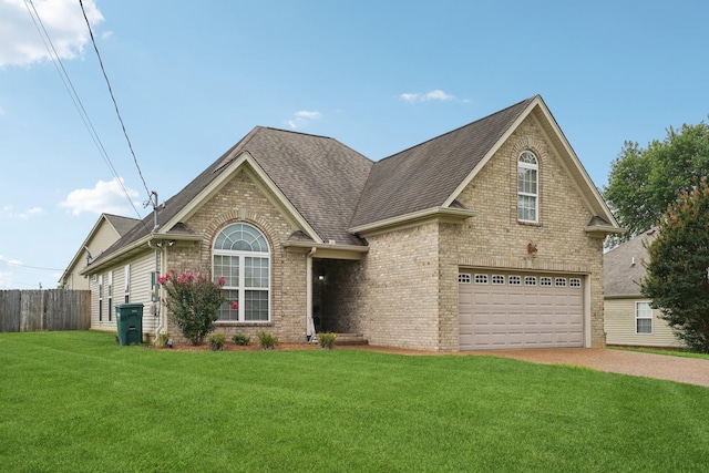 1319 Knoll Ln, Lebanon, TN 37087 - view of front of house with driveway, brick siding, roof with shingles, and an attached garage