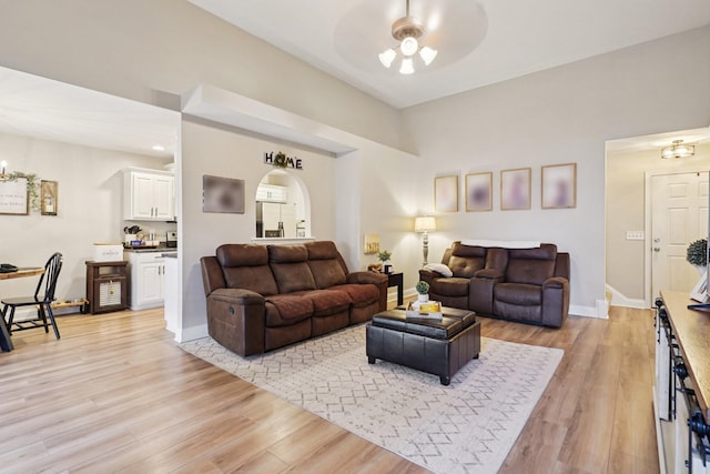 1319 Knoll Ln, Lebanon, TN 37087 - living room featuring a ceiling fan, light wood-style flooring, and arched walkways
