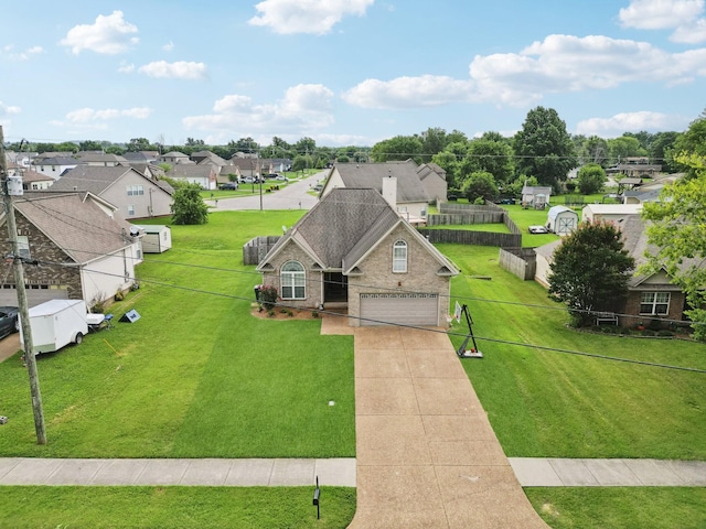 1319 Knoll Ln, Lebanon, TN 37087 - view of front of house featuring brick siding, driveway, a residential view, and an attached garage