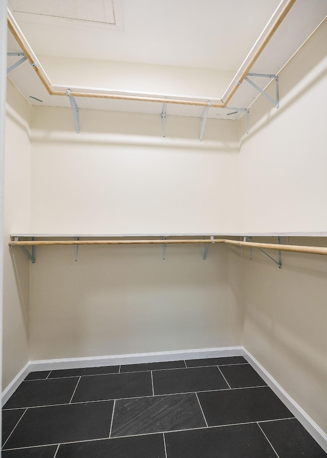 9656 Francis Ferry Rd, Rock Island, TN 38581 - spacious closet featuring dark tile patterned flooring