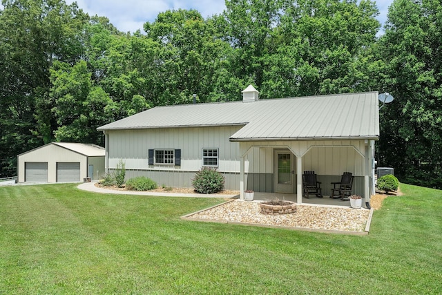 9656 Francis Ferry Rd, Rock Island, TN 38581 - view of front of property with a garage, a front yard, an outdoor structure, and a metal roof