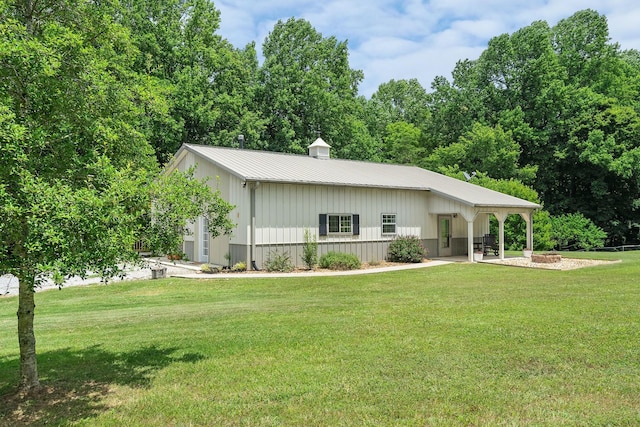 9656 Francis Ferry Rd, Rock Island, TN 38581 - view of front facade featuring a front yard, a metal roof, and board and batten siding