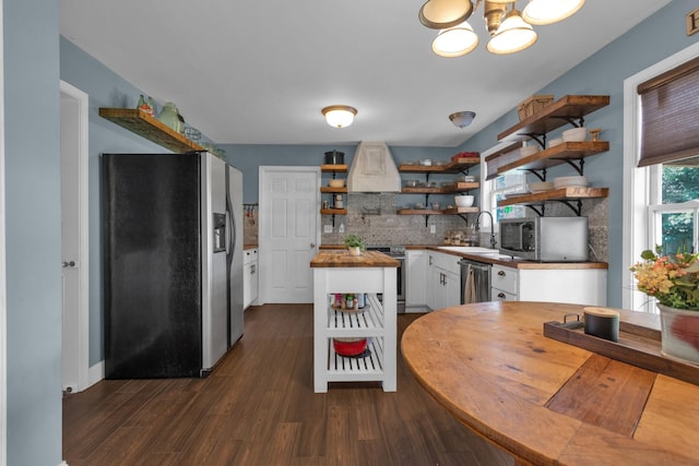 2105 Burgess Ln, Spring Hill, TN 37174 - kitchen featuring open shelves, stainless steel appliances, butcher block counters, premium range hood, and a kitchen island