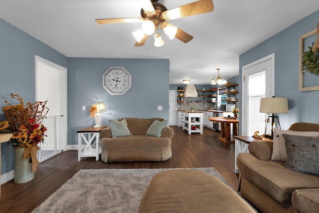 2105 Burgess Ln, Spring Hill, TN 37174 - living area featuring dark wood-style floors, ceiling fan, and a chandelier
