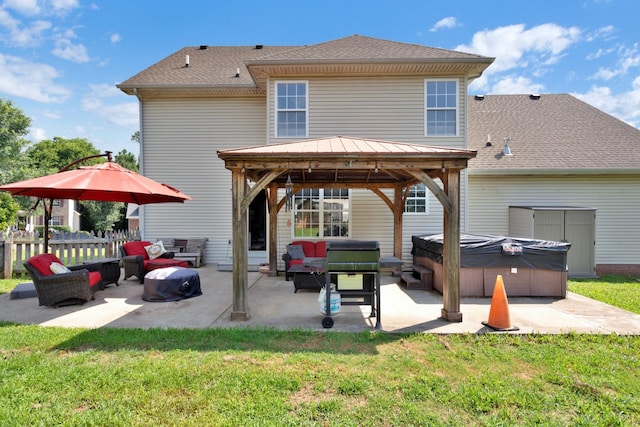 2105 Burgess Ln, Spring Hill, TN 37174 - back of house featuring a hot tub, a gazebo, a patio, and a shingled roof