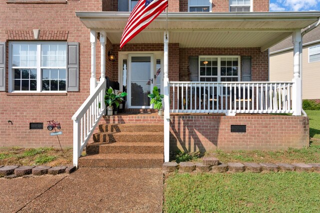 2105 Burgess Ln, Spring Hill, TN 37174 - property entrance featuring brick siding, a porch, and crawl space