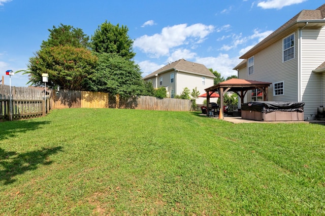 2105 Burgess Ln, Spring Hill, TN 37174 - fenced backyard featuring a hot tub, a gazebo, and a patio area