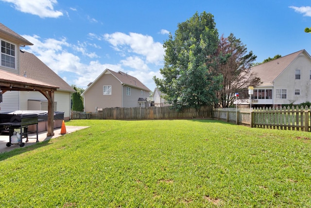 2105 Burgess Ln, Spring Hill, TN 37174 - fenced backyard featuring a hot tub, a patio area, a gazebo, and a residential view