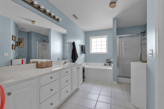 2105 Burgess Ln, Spring Hill, TN 37174 - bathroom featuring a bath, a stall shower, double vanity, and tile patterned flooring