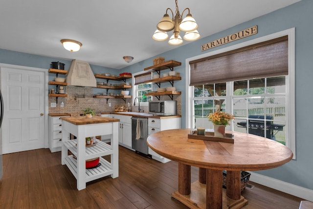 2105 Burgess Ln, Spring Hill, TN 37174 - kitchen with open shelves, wooden counters, stainless steel appliances, and tasteful backsplash