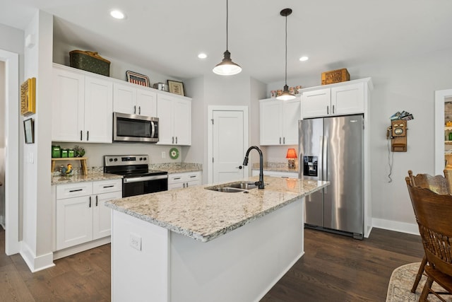 26 Sycamore Rdg W, Burns, TN 37029 - kitchen with appliances with stainless steel finishes, dark wood finished floors, white cabinets, recessed lighting, and decorative light fixtures