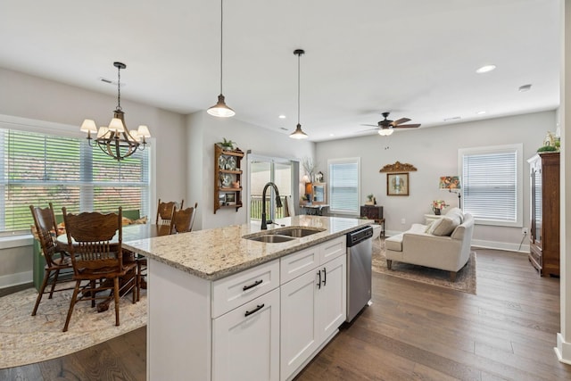 26 Sycamore Rdg W, Burns, TN 37029 - kitchen featuring stainless steel dishwasher, open floor plan, hanging light fixtures, white cabinetry, and light stone countertops