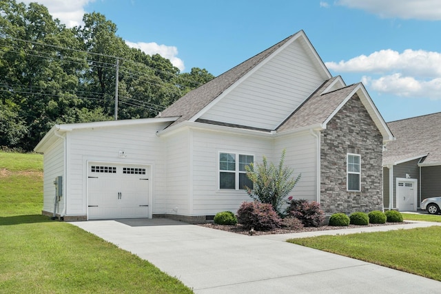 26 Sycamore Rdg W, Burns, TN 37029 - view of front of home with an attached garage, concrete driveway, a front yard, and roof with shingles