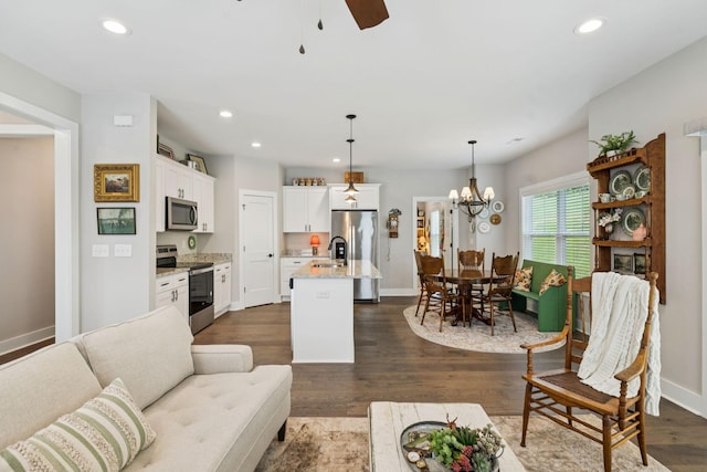 26 Sycamore Rdg W, Burns, TN 37029 - living area featuring recessed lighting, dark wood-style flooring, a ceiling fan, and a chandelier