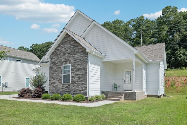 26 Sycamore Rdg W, Burns, TN 37029 - view of side of property with stone siding, a yard, and roof with shingles