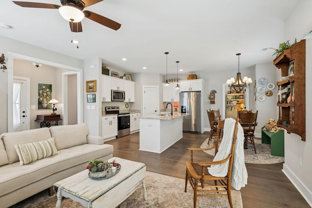 26 Sycamore Rdg W, Burns, TN 37029 - living area with dark wood-type flooring, a ceiling fan, a chandelier, and recessed lighting