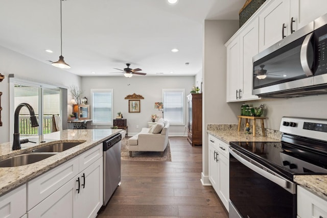 26 Sycamore Rdg W, Burns, TN 37029 - kitchen featuring appliances with stainless steel finishes, a ceiling fan, dark wood-type flooring, open floor plan, and recessed lighting
