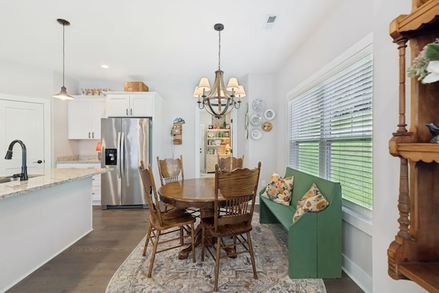 26 Sycamore Rdg W, Burns, TN 37029 - dining room with dark wood-style floors and a chandelier