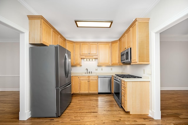 1436 Cheshire Pl, Murfreesboro, TN 37129 - kitchen with stainless steel appliances, light brown cabinetry, light countertops, light wood-style flooring, and ornamental molding