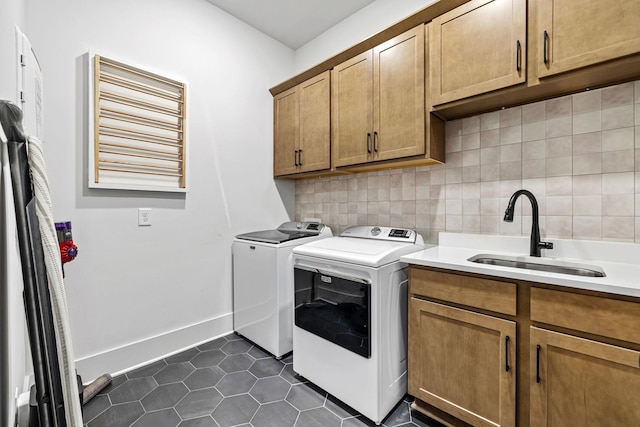 5831 Branta Dr, Franklin, TN 37064 - laundry room featuring cabinet space, washer and dryer, and dark tile patterned floors