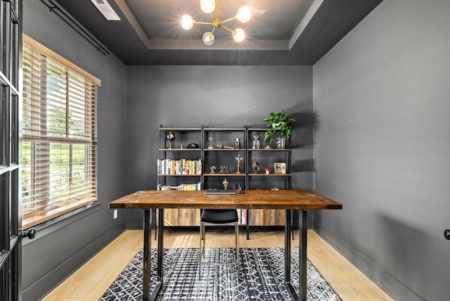 5831 Branta Dr, Franklin, TN 37064 - office space featuring wood finished floors, a chandelier, and a tray ceiling