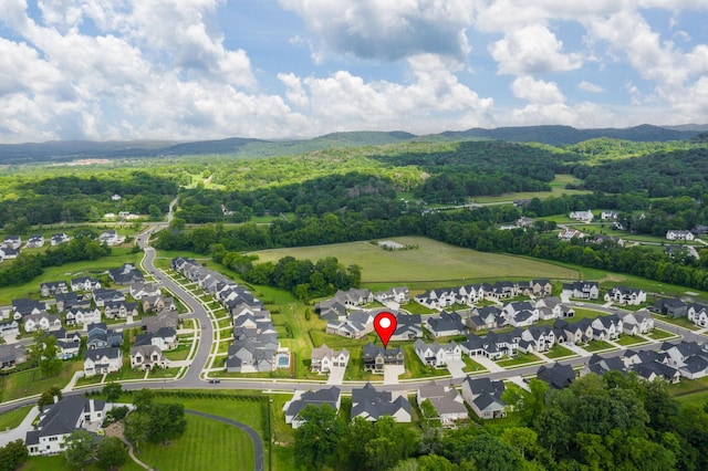 5831 Branta Dr, Franklin, TN 37064 - aerial overview of property's location featuring a heavily wooded area and a mountain backdrop
