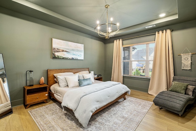 5831 Branta Dr, Franklin, TN 37064 - bedroom with a raised ceiling, a chandelier, light wood-style flooring, and recessed lighting