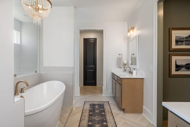 5831 Branta Dr, Franklin, TN 37064 - full bath with vanity, a soaking tub, and a chandelier