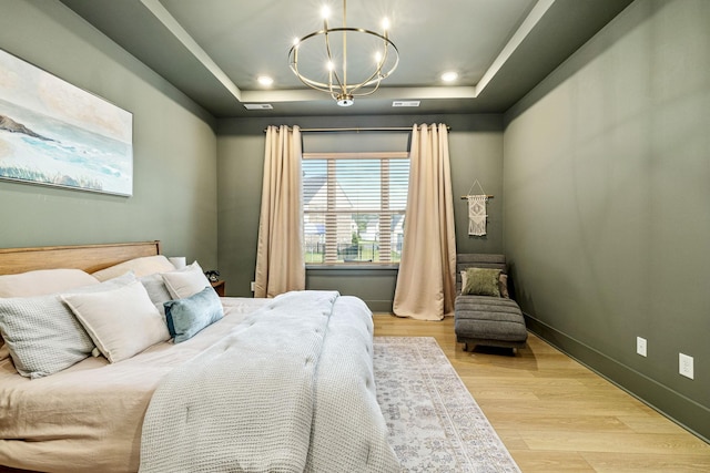 5831 Branta Dr, Franklin, TN 37064 - bedroom with a raised ceiling, a chandelier, and wood finished floors